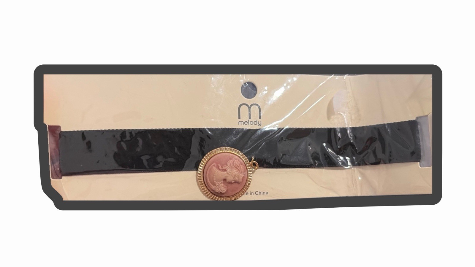 Melody velvet choker necklace with a prominent rose gold toned cameo medallion
