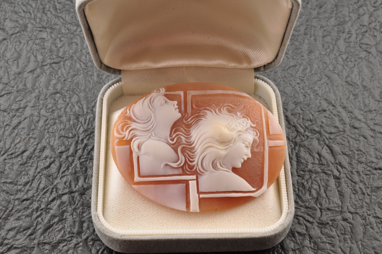 Vintage oval shape shell cameo “Two Girls” (64.0ct), sign by artist with case.