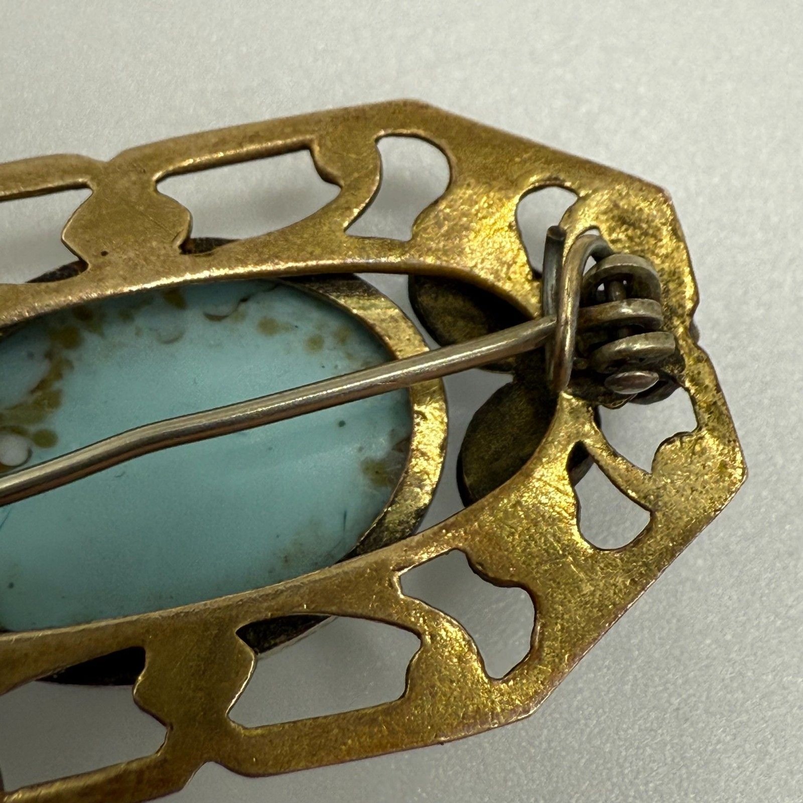 Turquoise brass brooch vintage source unknown