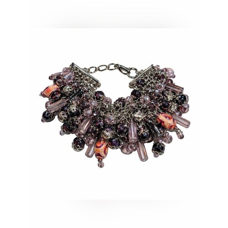 Striking vintage artisan beaded bracelet featuring a dramatic cluster fringe
