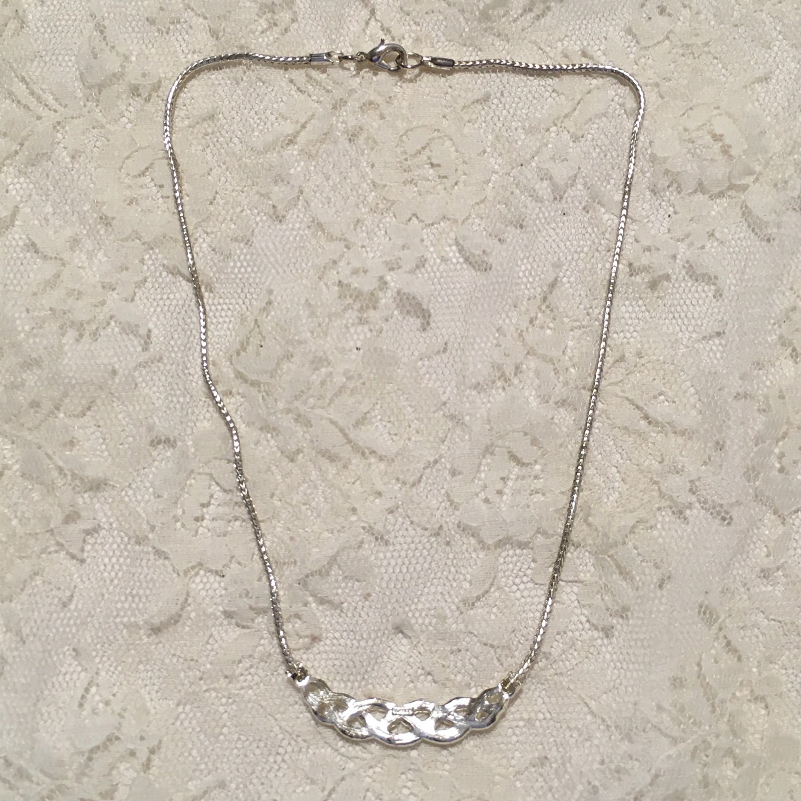 Vintage Interwoven Curved Pendant Necklace Roman signed Rhinestones Silver tone