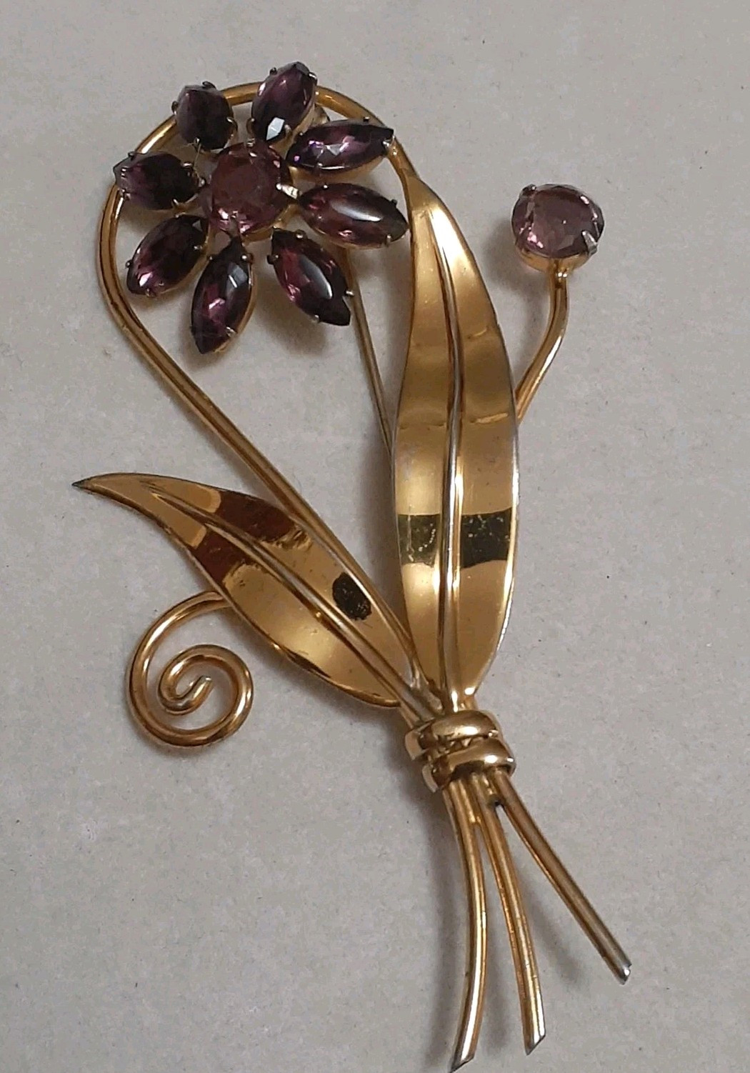 Sterling silver gold plated prong set purple glass flower & stem leaf brooch
