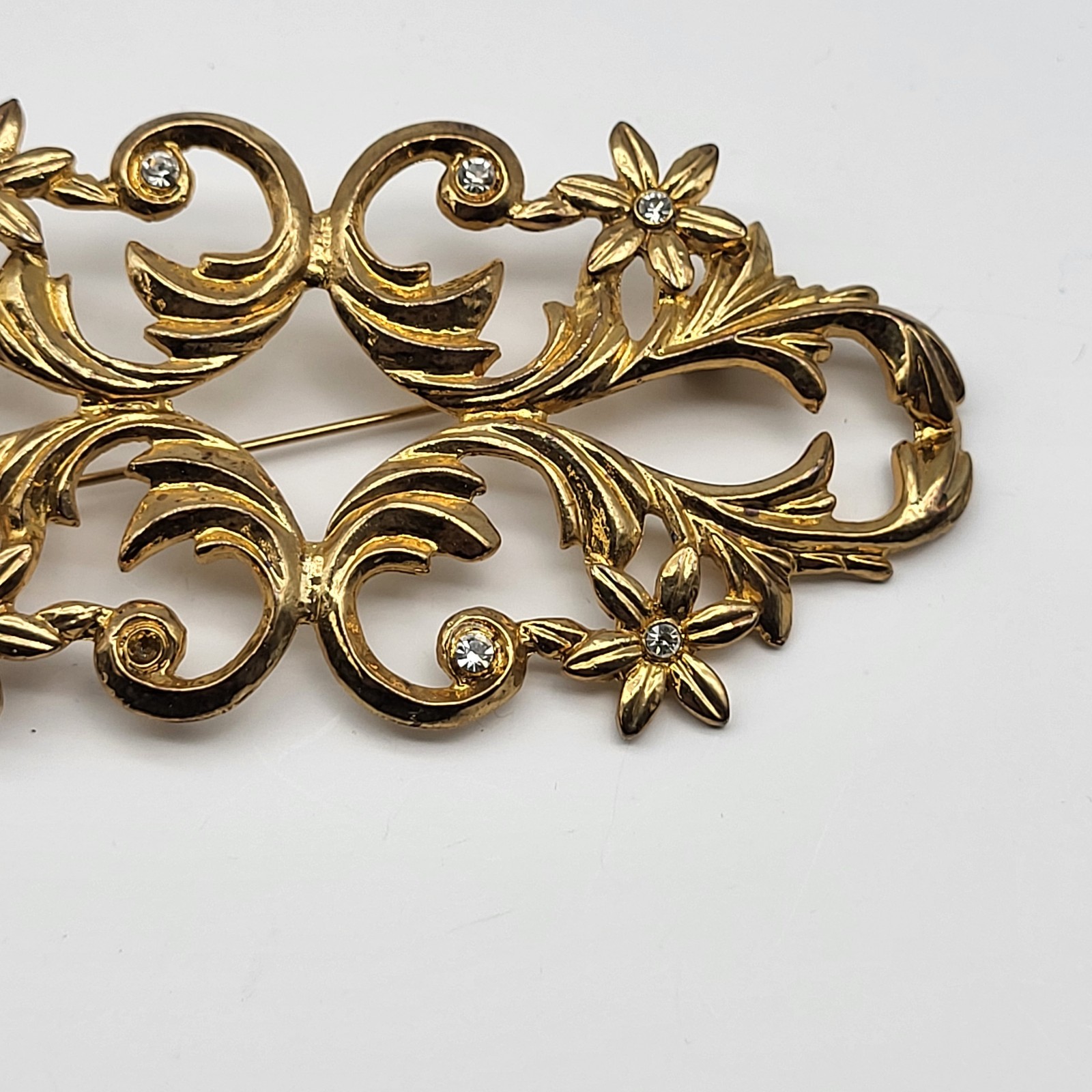 lovely vintage brooch pin elegant scrollwork rhinestone flower unsigned