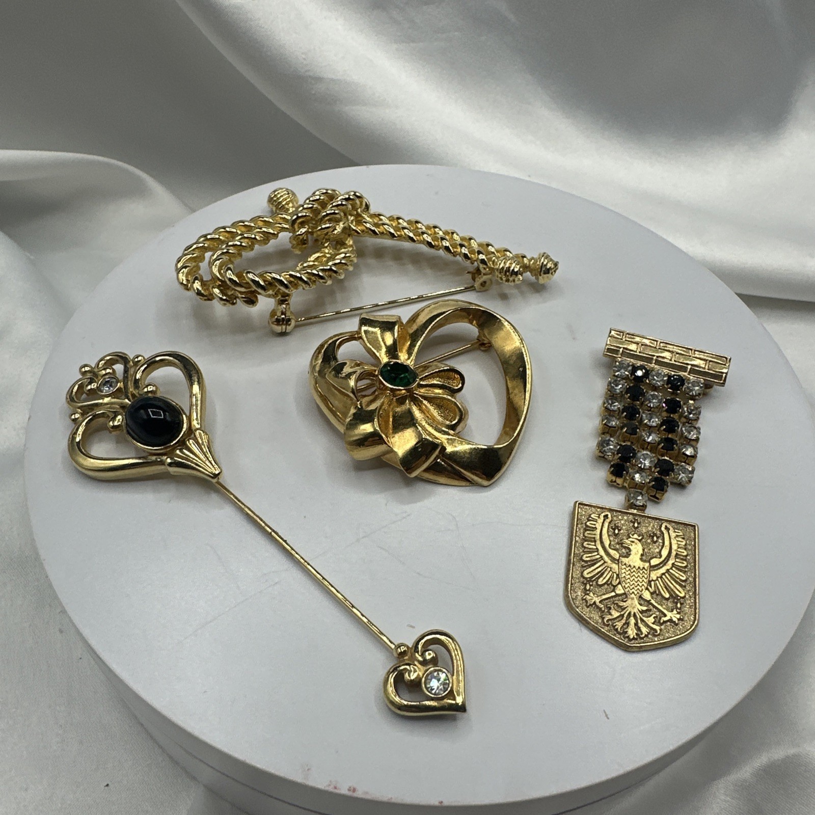 Three Mixed Vtg Gold Toned Brooches and One Pon.See pics.