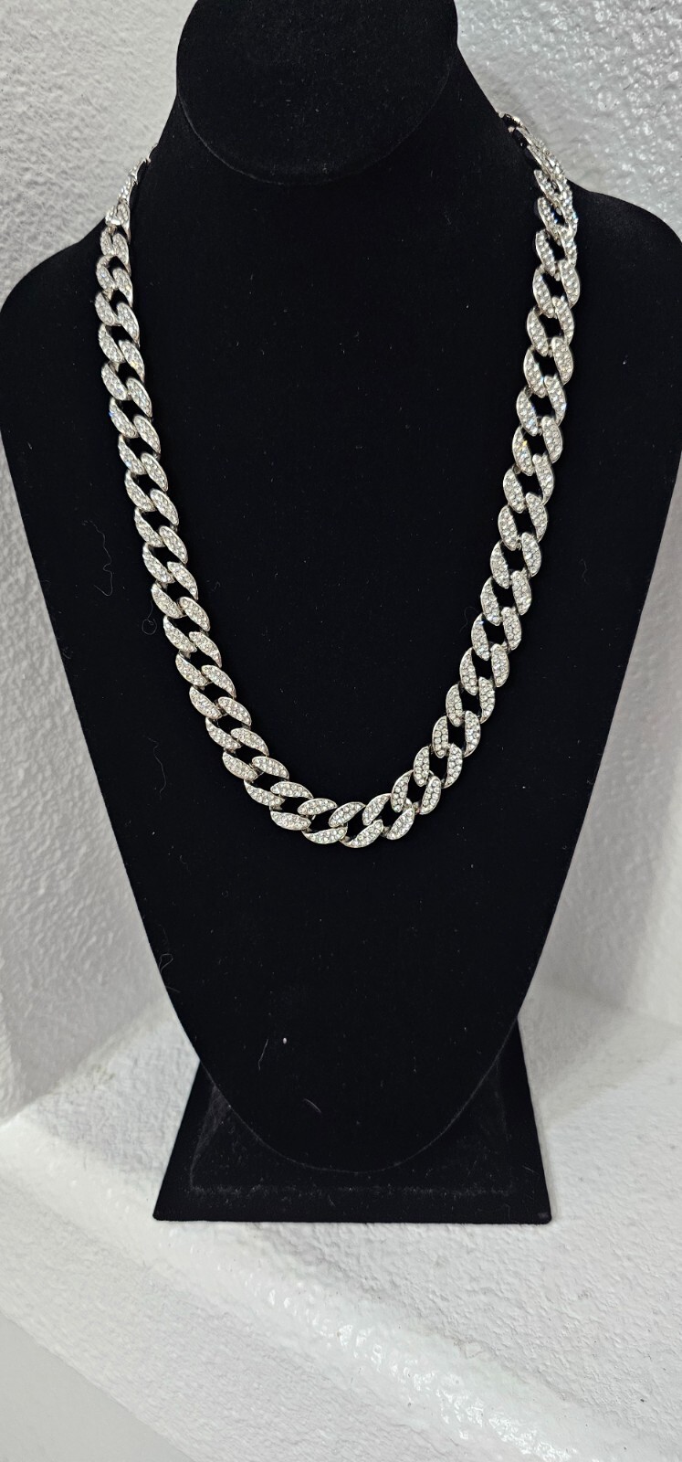 Cuban chain necklace silver tone one side many crystals other side plain.
