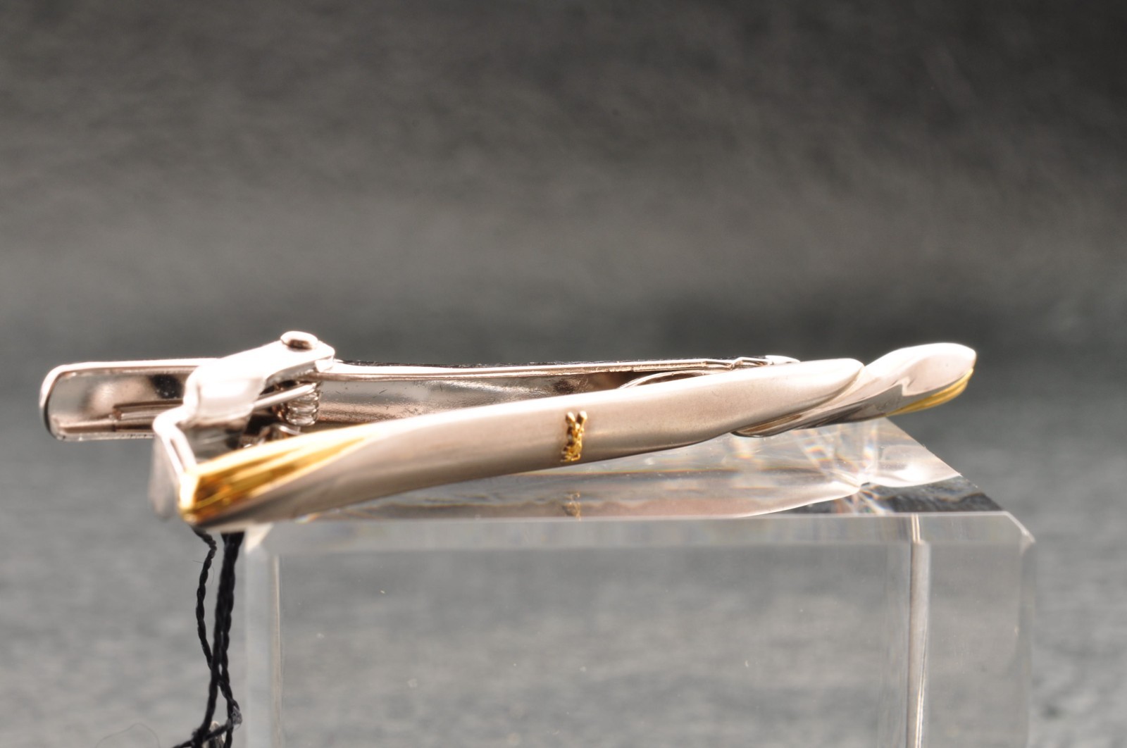Near mint, gold and Cufflinks and silver tie clip, “Yves Saint Laurent”, case.
