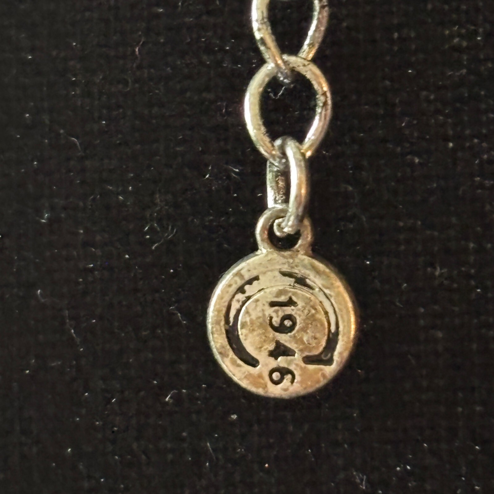 “1946” Multi-Strand Silver-Tone Necklace Textured Round Pendant 5 Chains Trendy