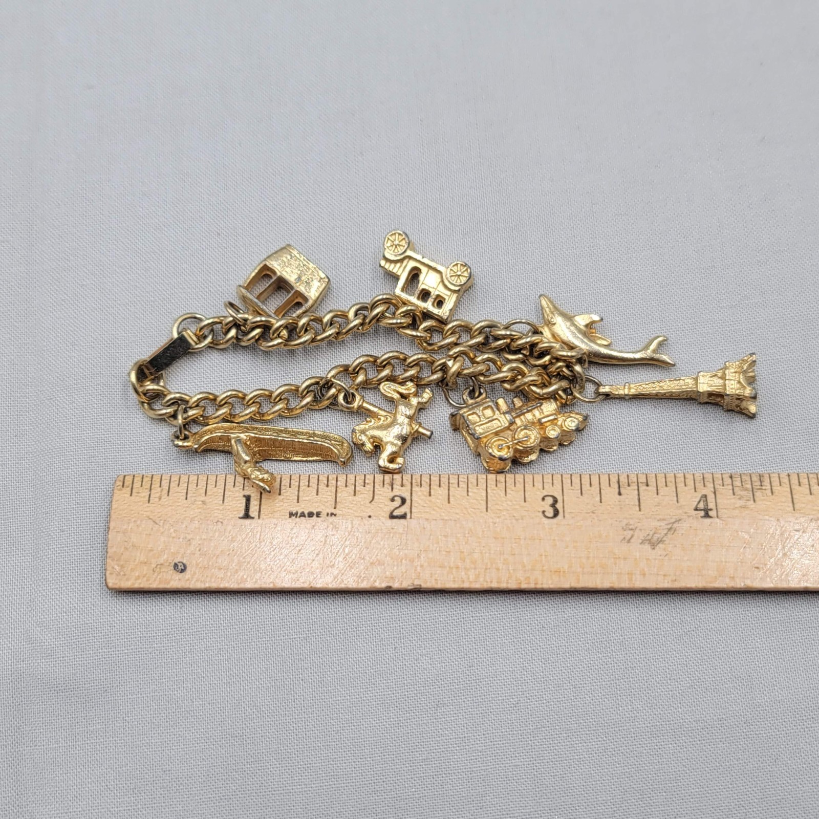 Vintage Charm Bracelet Gold tone Estate Costume 7 Dangle Charms 6.5″