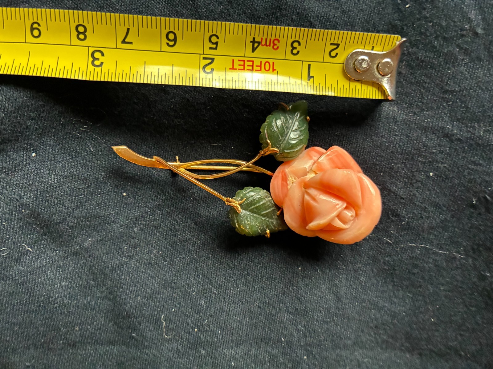 Charming rose-shaped coral pin with enamel leaves