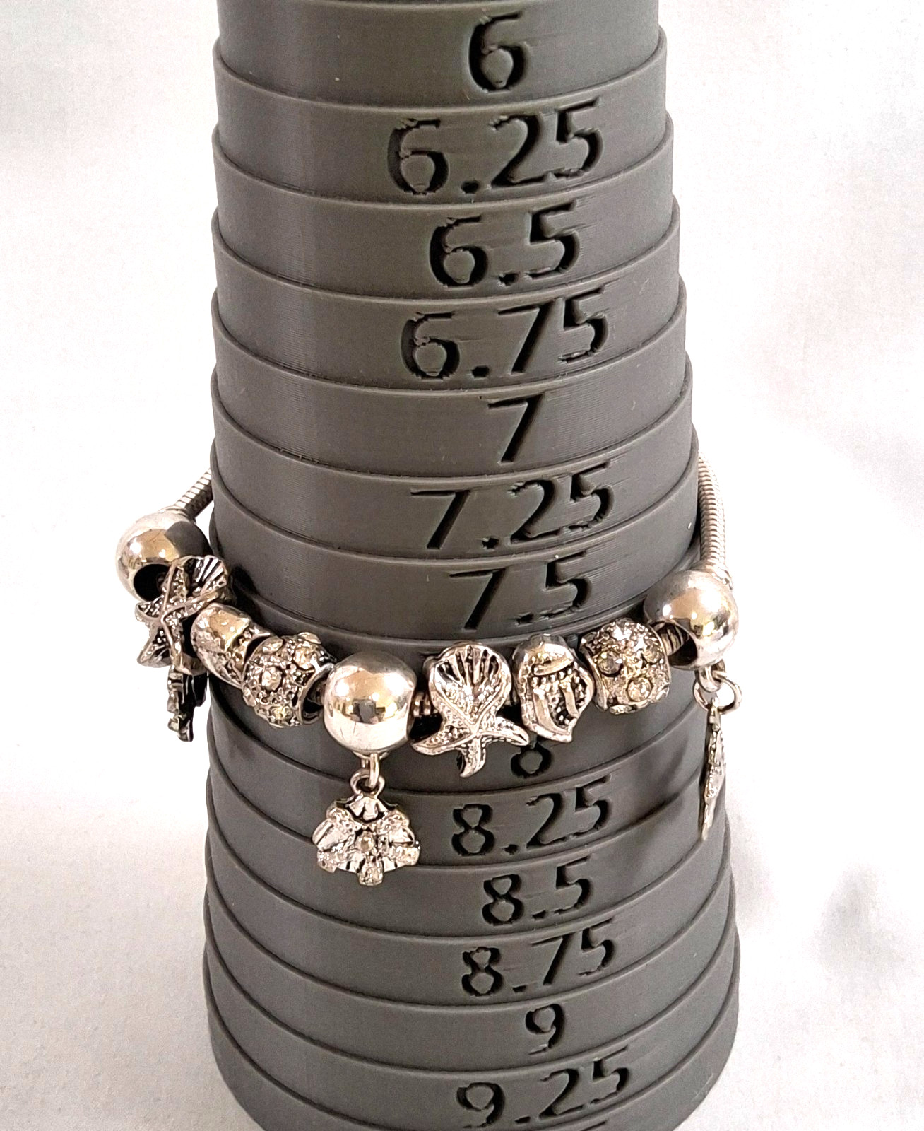 silver tone sea creatures shell 9 charm slide bracelet design