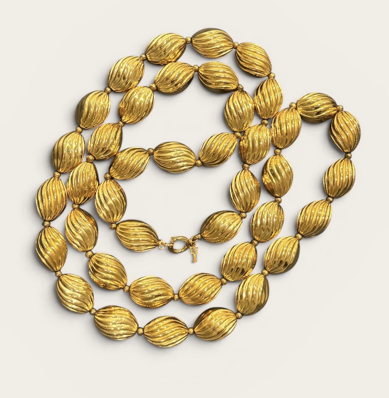 Signed Crown Trifari Vintage Gold Tone Ribbed Oval Bead Opera Long Necklace