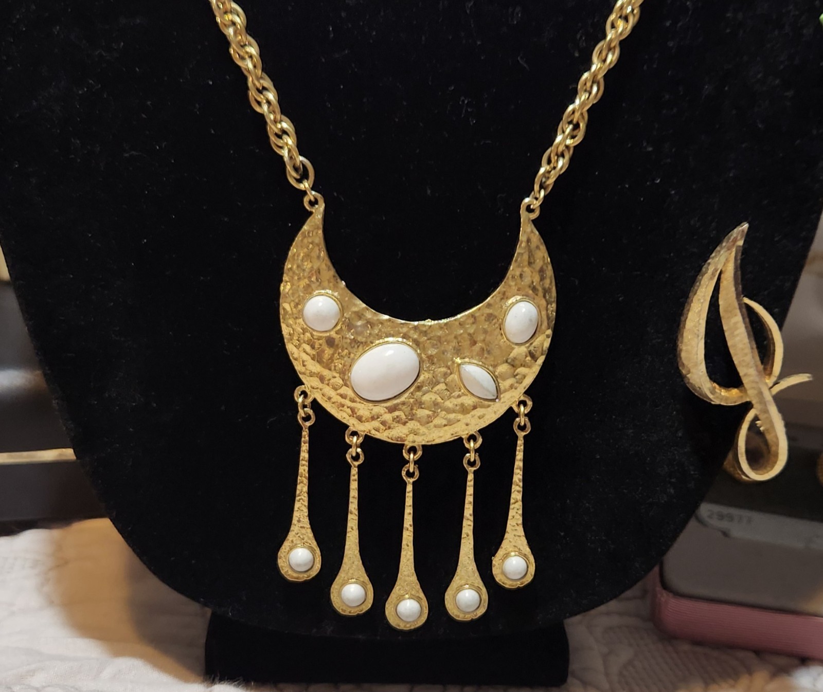 Vintage gold-toned necklace Crescent moon pendant with a hammered finish.