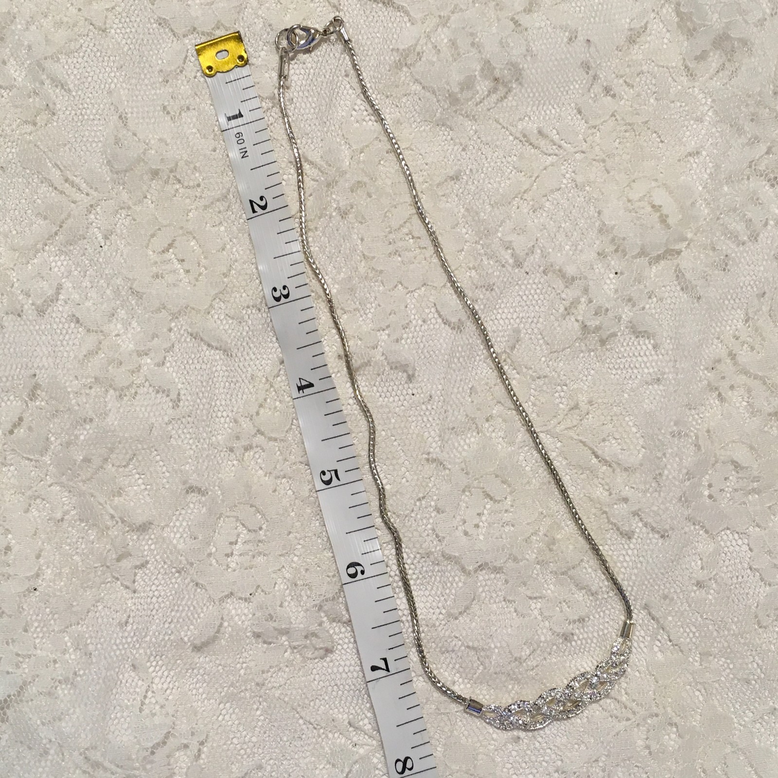 Vintage Interwoven Curved Pendant Necklace Roman signed Rhinestones Silver tone