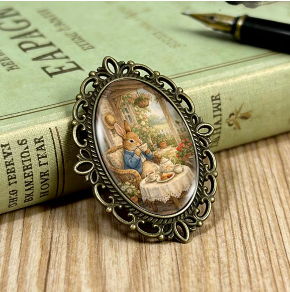 BROOCH- Rabbit’s Tea Party Brooch Oval Lace-Edged Glass Brooch