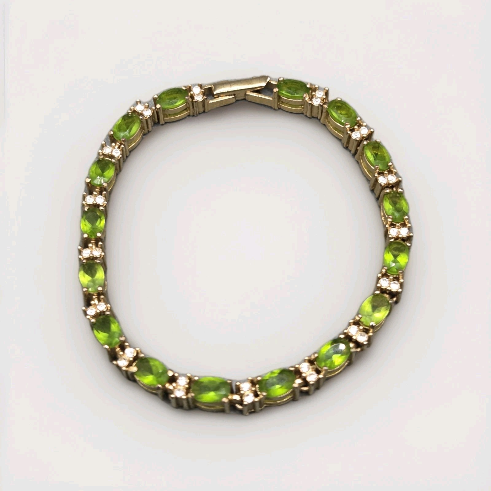 Avon Tennis Bracelet Gold Tone Peridot & Clear Rhinestones 6.75″