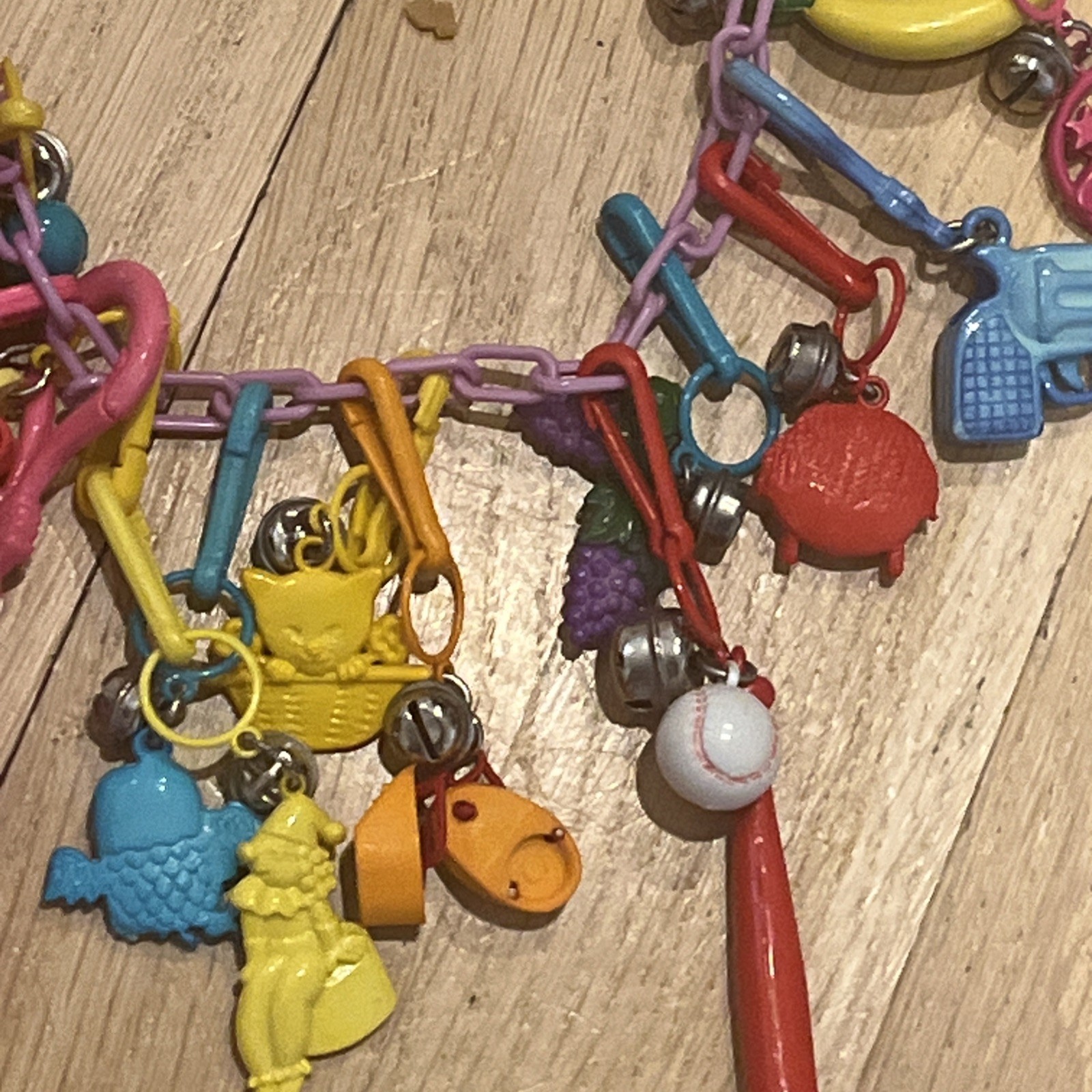 Vintage 1980s Plastic Clip-0n Bell Charm Necklace..20 charms