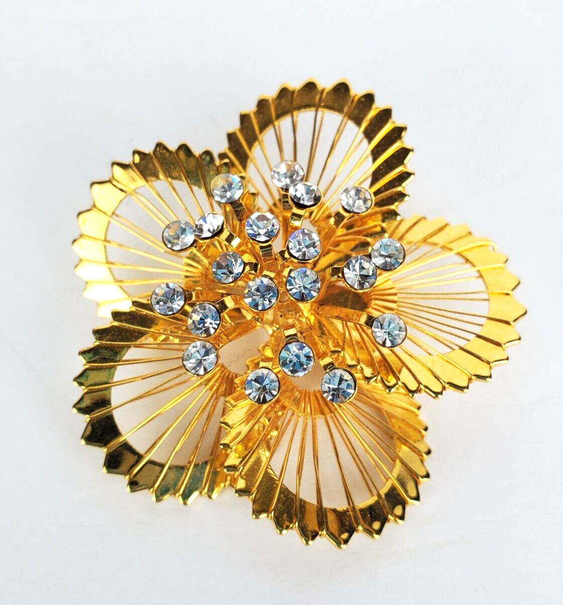 Vintage Monet Gold Tone Open Metal Wire Clear Rhinestones Flower Brooch Pin