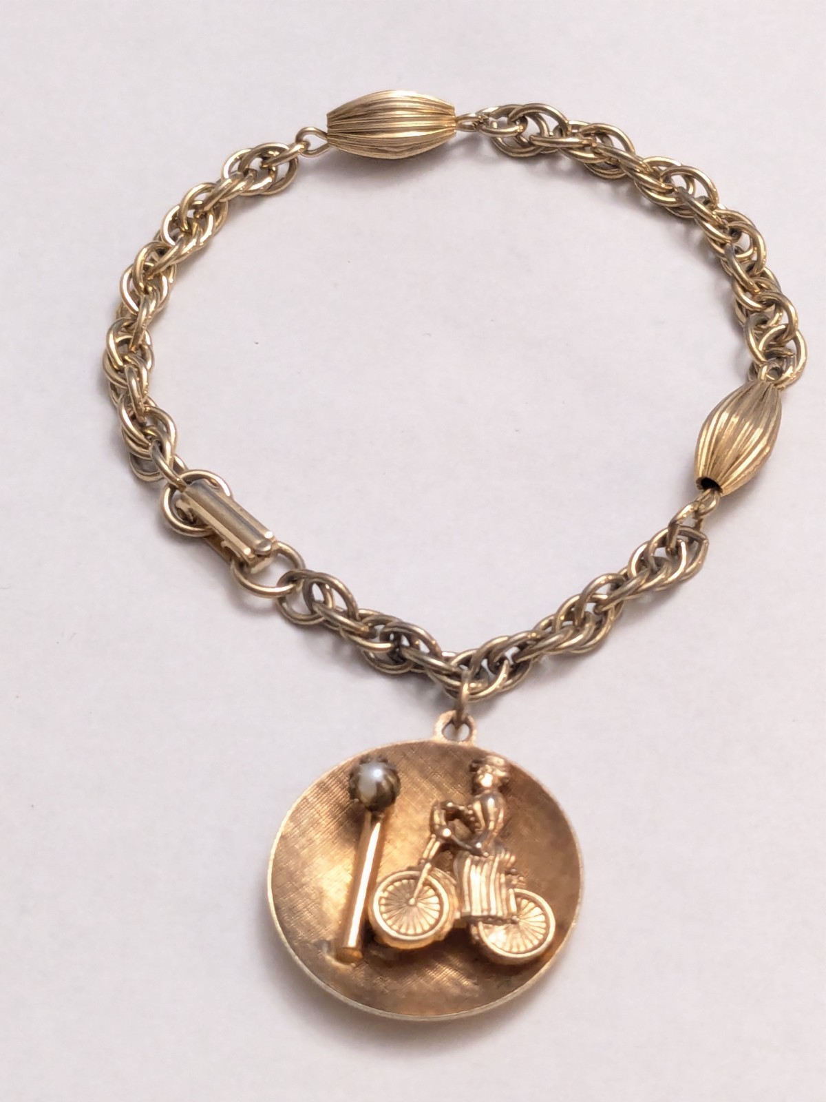 Vintage Mid-Century Gold Tone Lady on Bicycle Charm Bracelet