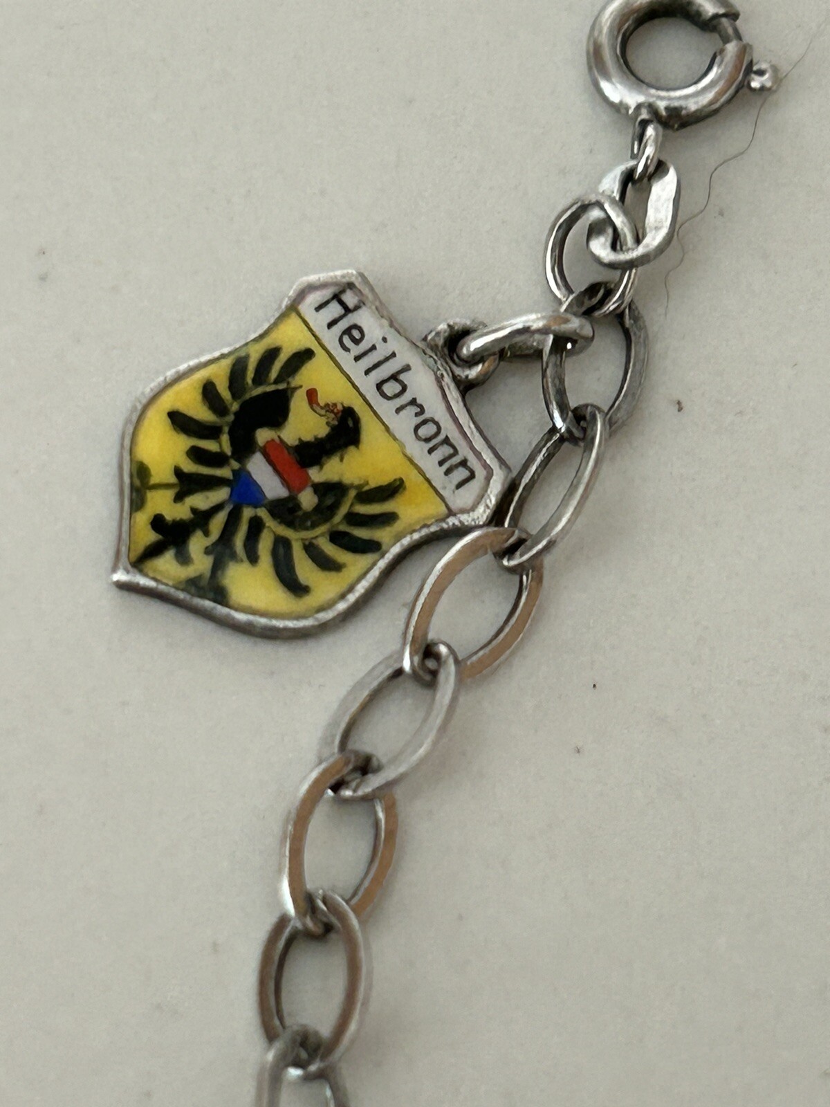VINTAGE SOLID SILVER AND ENAMEL TRAVEL CHARM BRACELET6 COAT OF ARMS (8 TOTAL)