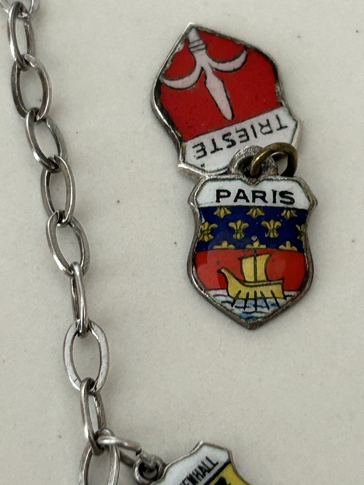 VINTAGE SOLID SILVER AND ENAMEL TRAVEL CHARM BRACELET6 COAT OF ARMS (8 TOTAL)