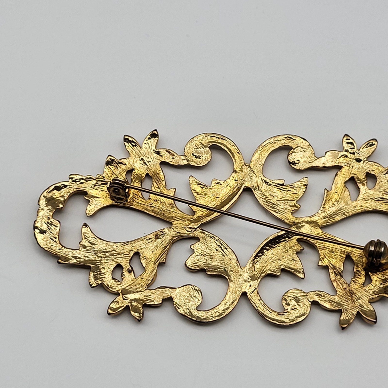 lovely vintage brooch pin elegant scrollwork rhinestone flower unsigned