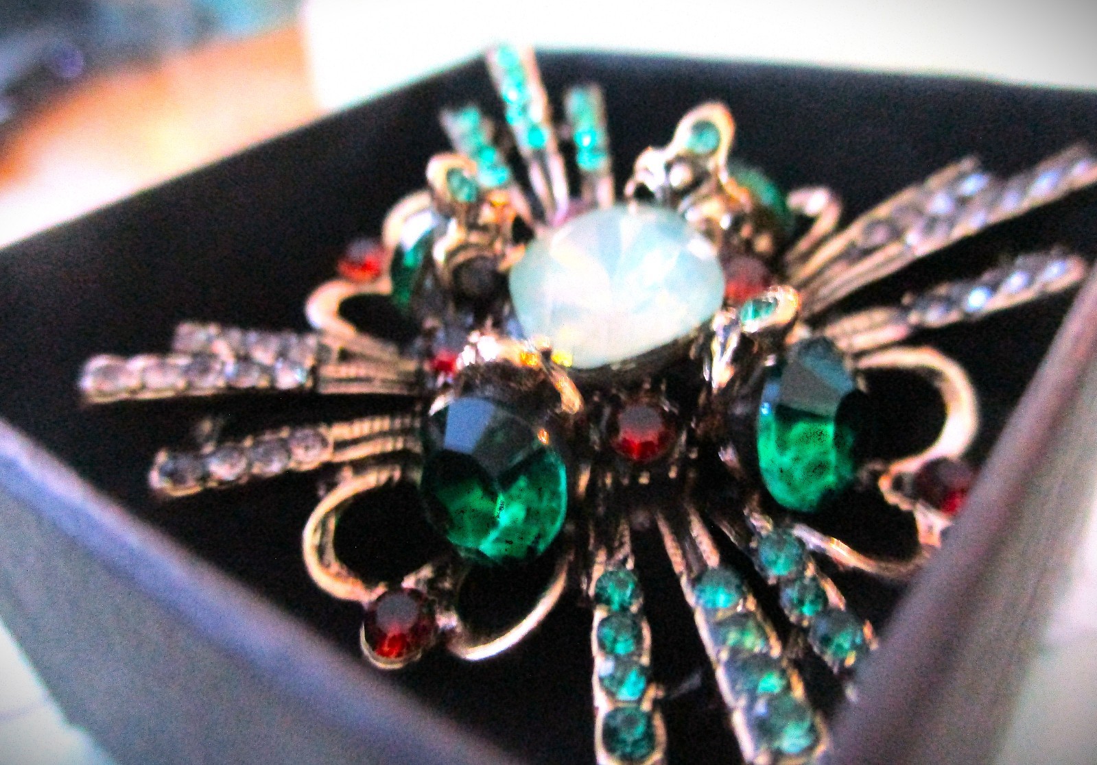 large brooch gold tone with faux opal + red, green &clear zircons