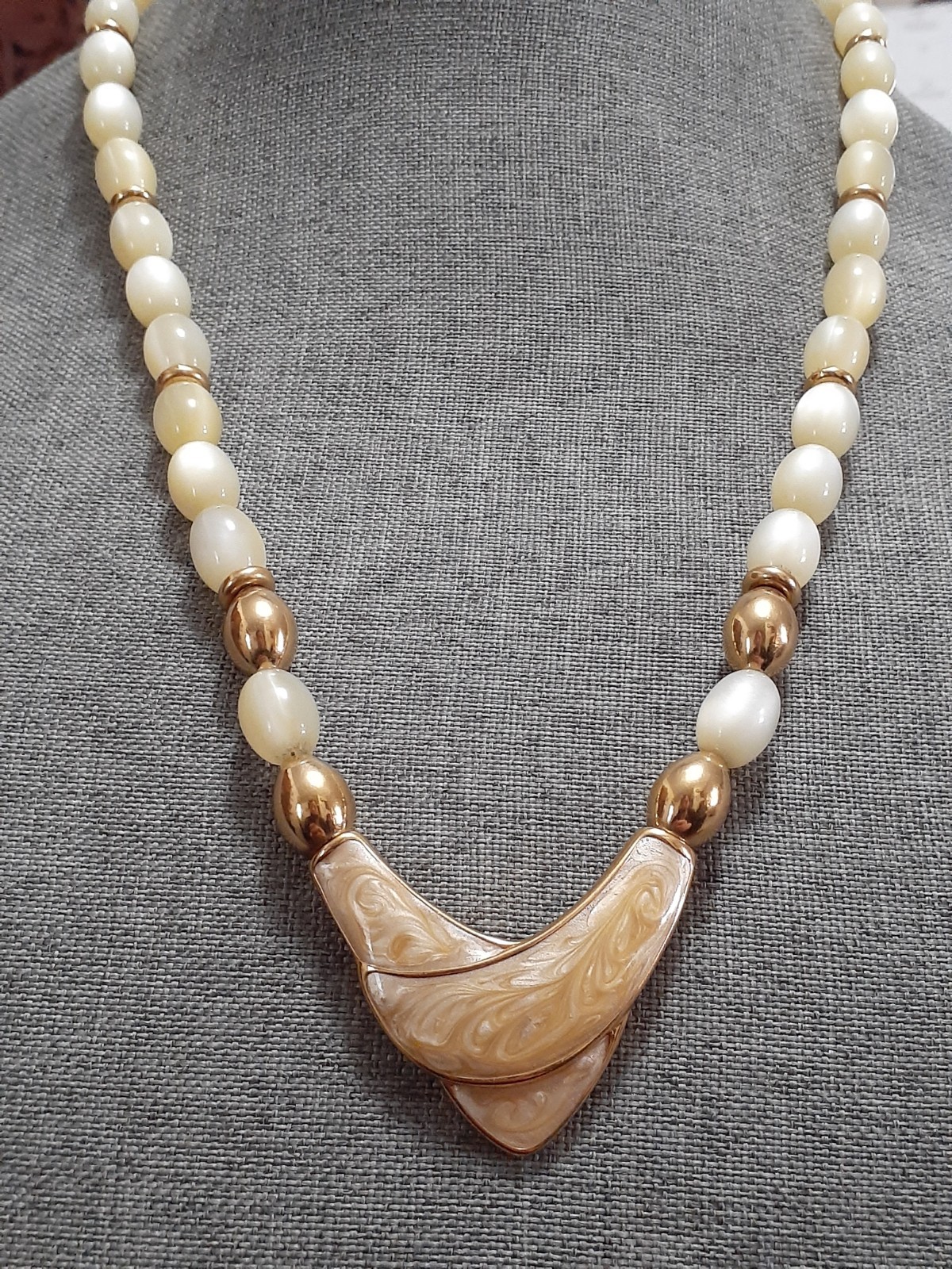 Napier champagne moonglow lucite bead necklace w/Chevron enamel pendant 24″