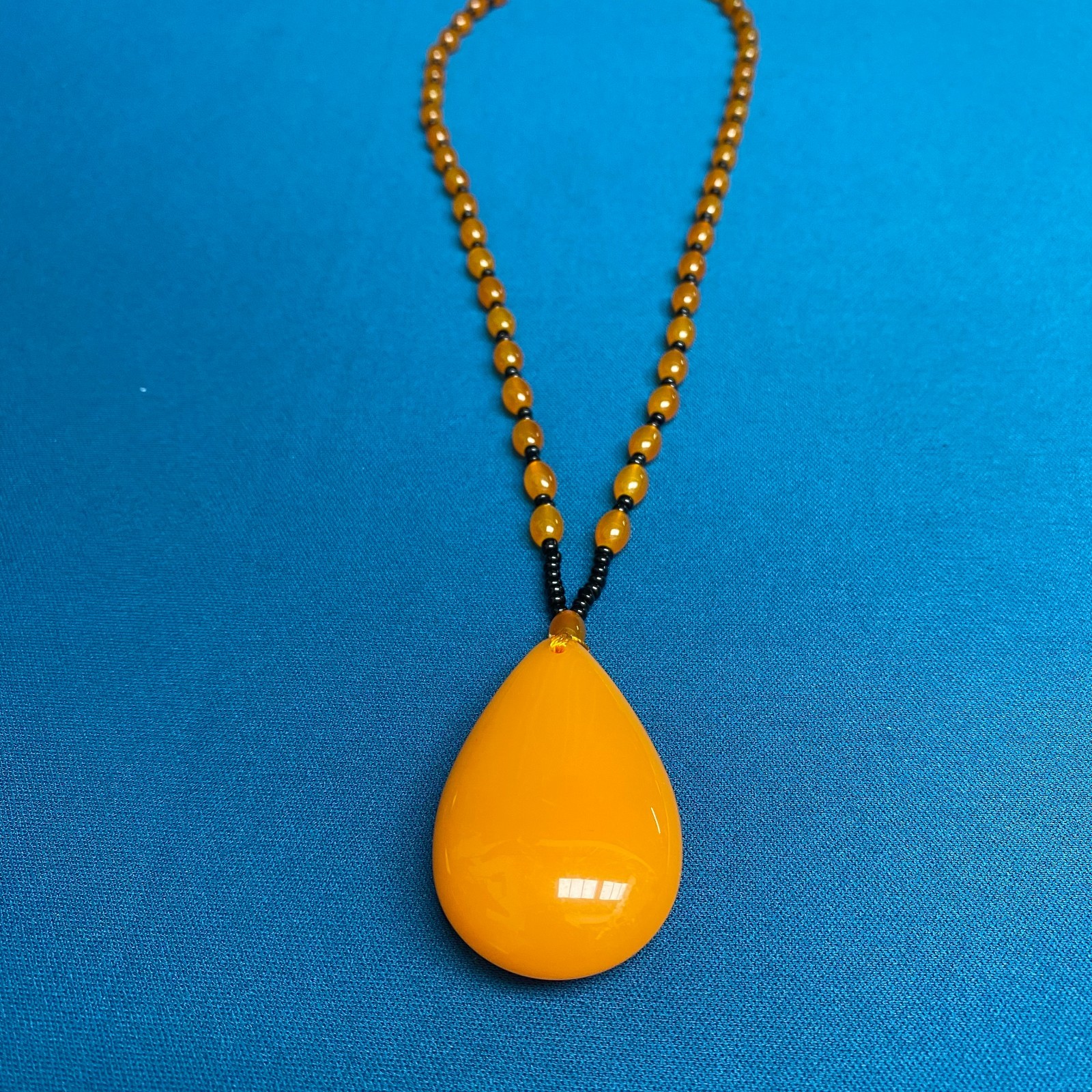 Oversized Amber-Tone Teardrop Pendant with Beaded Necklace