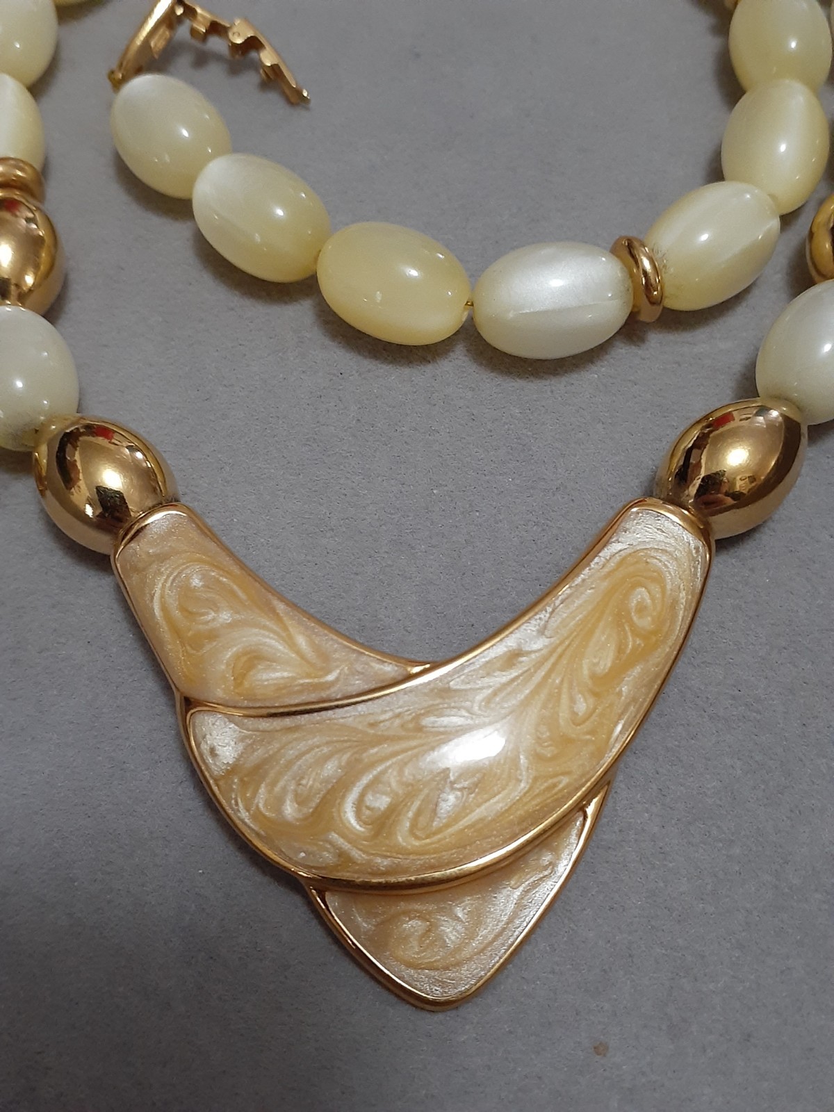 Napier champagne moonglow lucite bead necklace w/Chevron enamel pendant 24″
