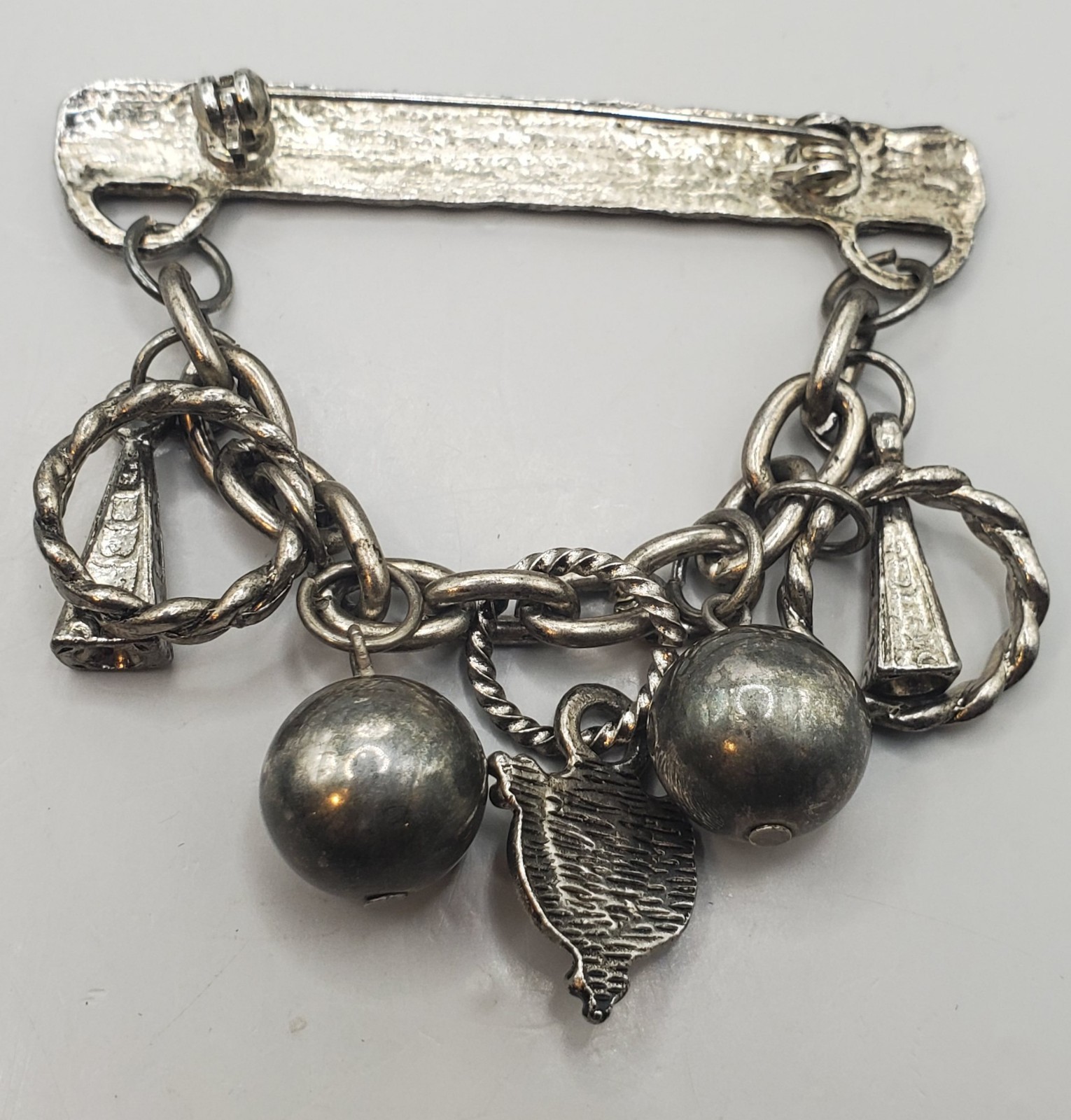 3 Brooches: Tribal Peacock Feather Clay Mask, RITZ Pewter Face, Bar W/ Charms