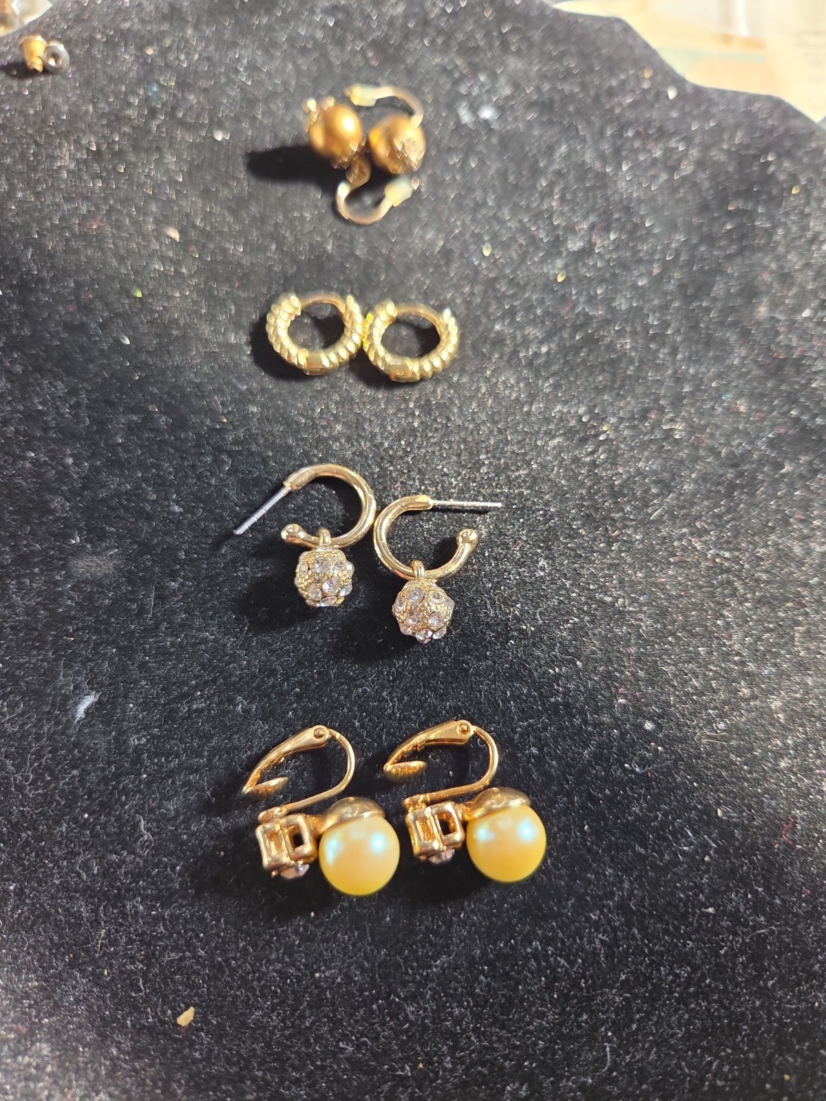 Four pairs of 10k gold plated one pair pearls clip-ons Avon.