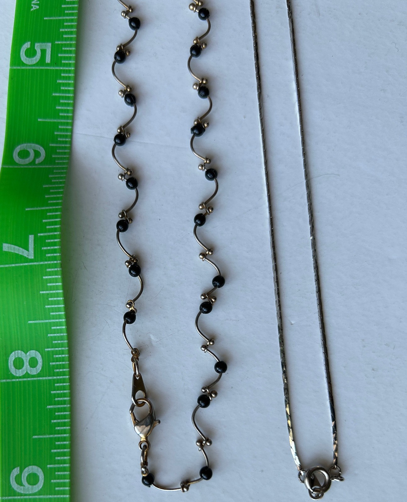 Lot of 2 Delicate Silvertone necklaces -One with black beads curvy design strand