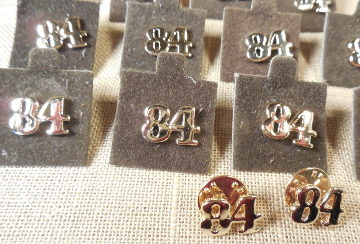 Vintage NOS lot of 15 gold tone 1984 tac lapel pins 1/2″ D79