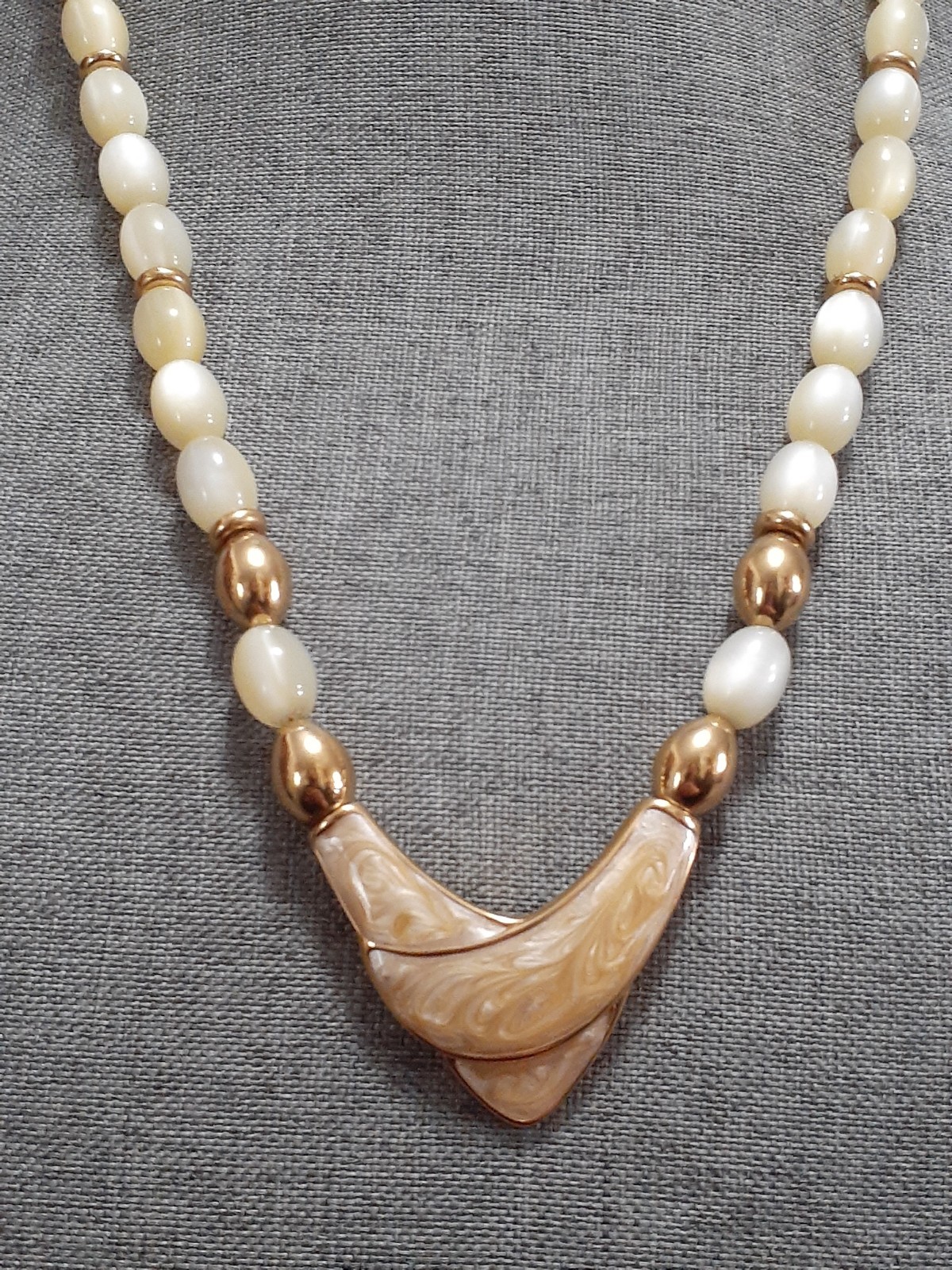 Napier champagne moonglow lucite bead necklace w/Chevron enamel pendant 24″
