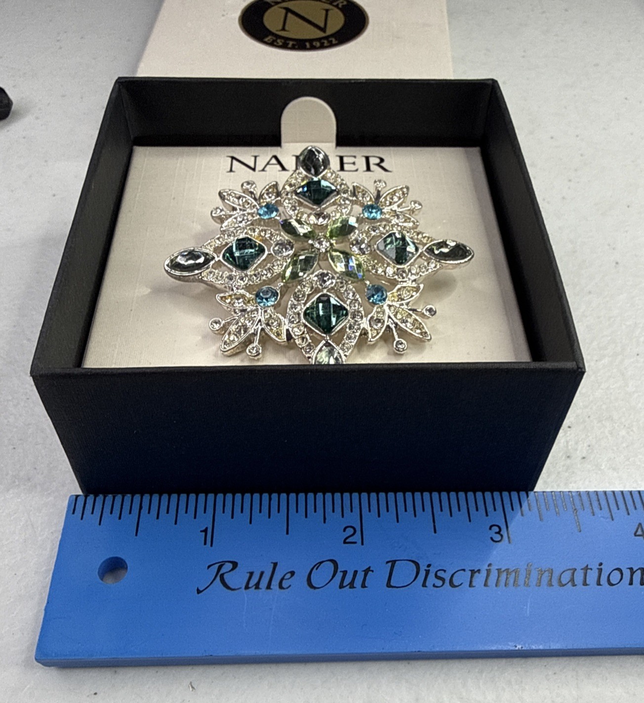 Napier silver-tone snowflake pin/brooch featuring blue and green rhinestones NOS