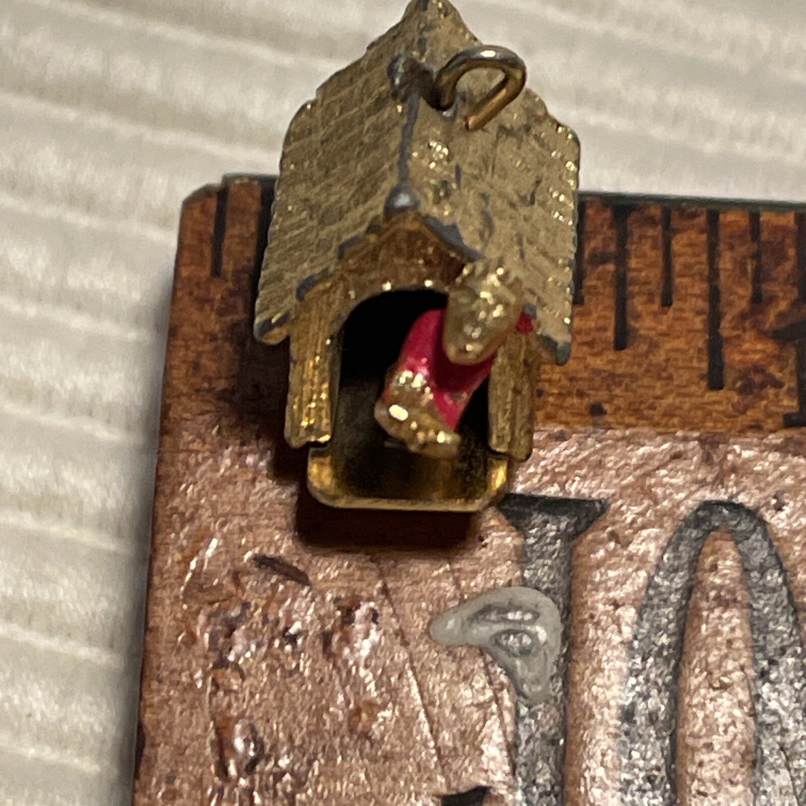 1960’s Man in Doghouse Goldtone Bracelet Charm Mechanical Signed C S Red Paint