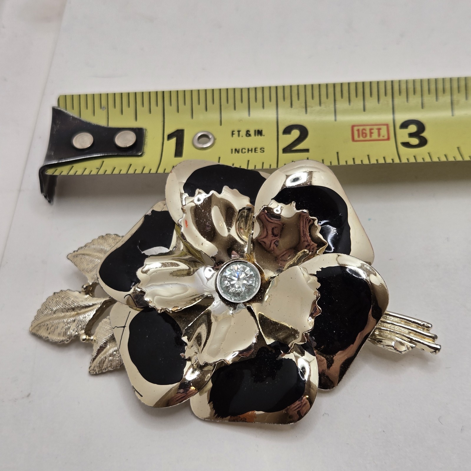 Black & Gold Tone Brooch/Pin With Moissanite Center Stone. Preowned Very Good