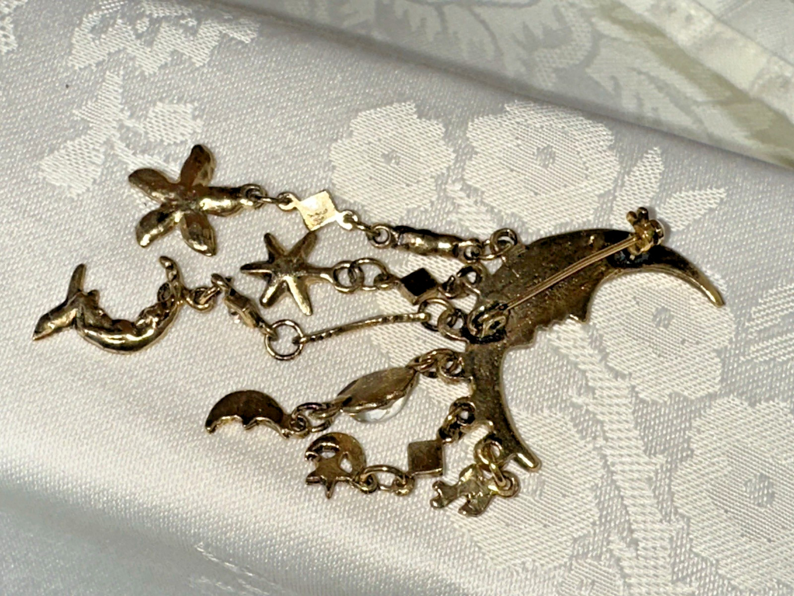 Gold Tone Crescent Moon With Dangling Stars, Cupid, Moon, Rhinestones Brooch