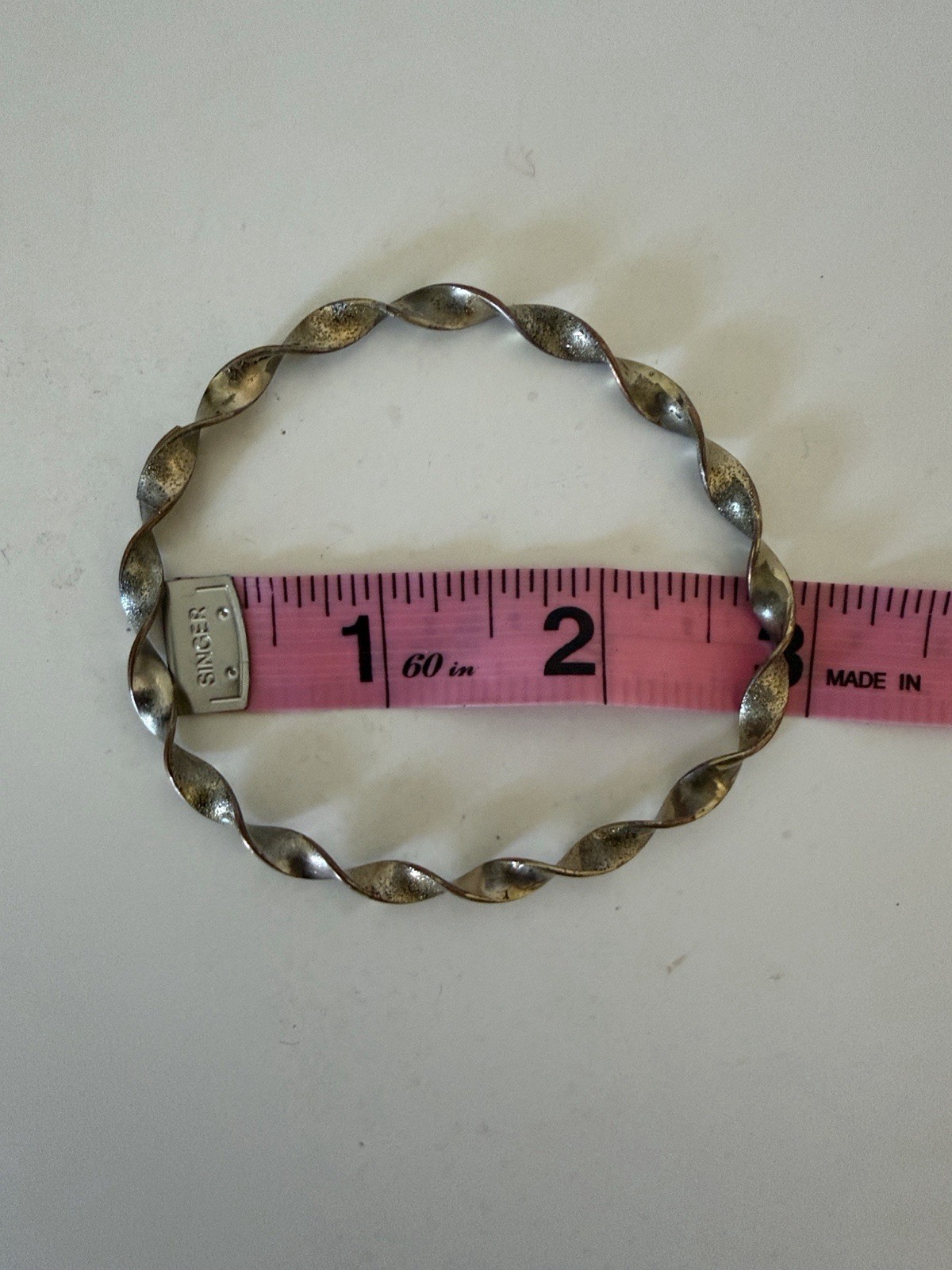 Twisted Metal Bangle Bracelet in Silver Tone
