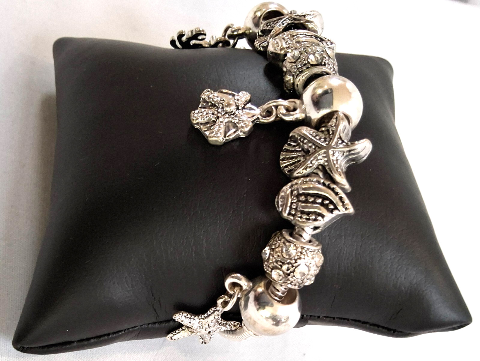 silver tone sea creatures shell 9 charm slide bracelet design