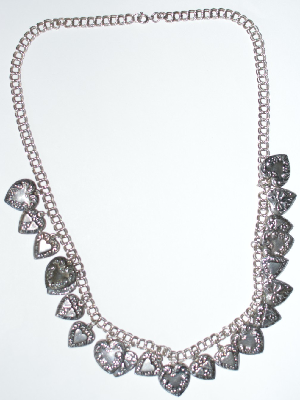 Signed PAJ 925 repousse multiple heart charms necklace 58 grams 24 inches long
