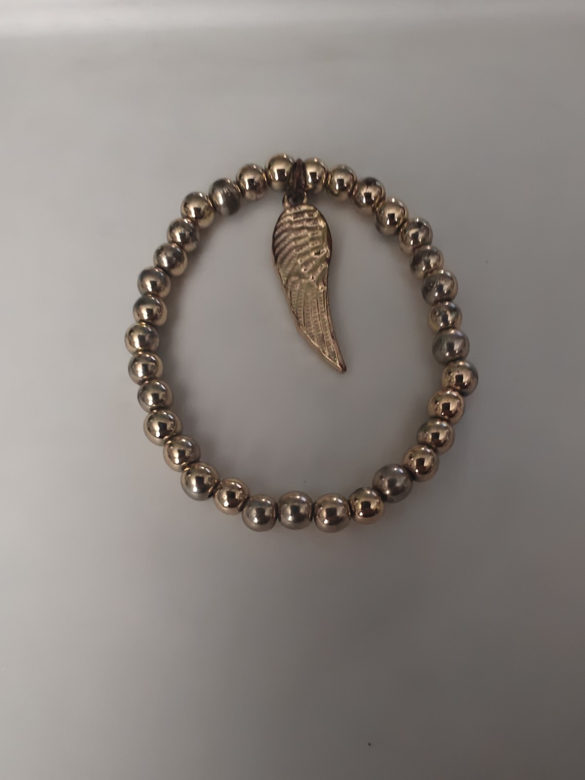 Designer Vintage Plastic Gold Colored Bead And Charm Bracelet Wing