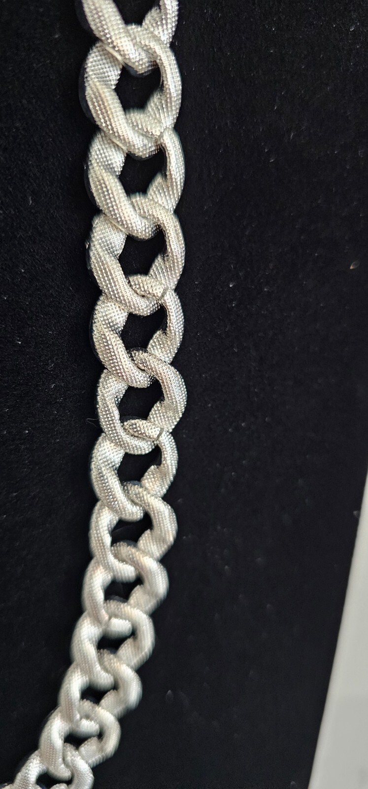 Cuban chain necklace silver tone one side many crystals other side plain.