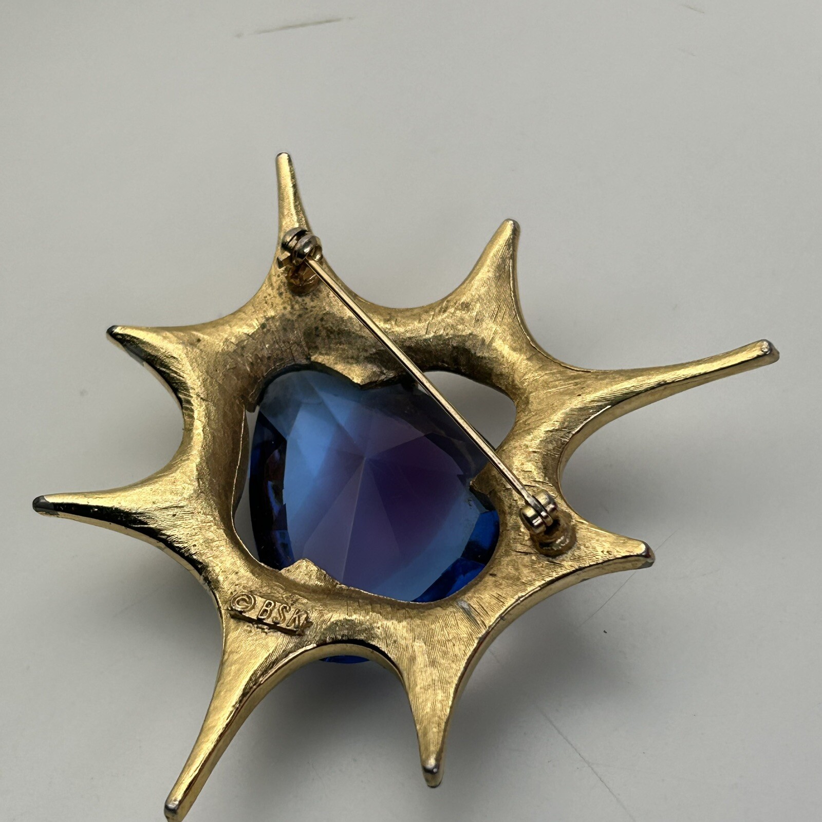 Atomic Blast Brooch Pin Signed BSK Gold Tone Blue Stone Starburst Vintage MCM