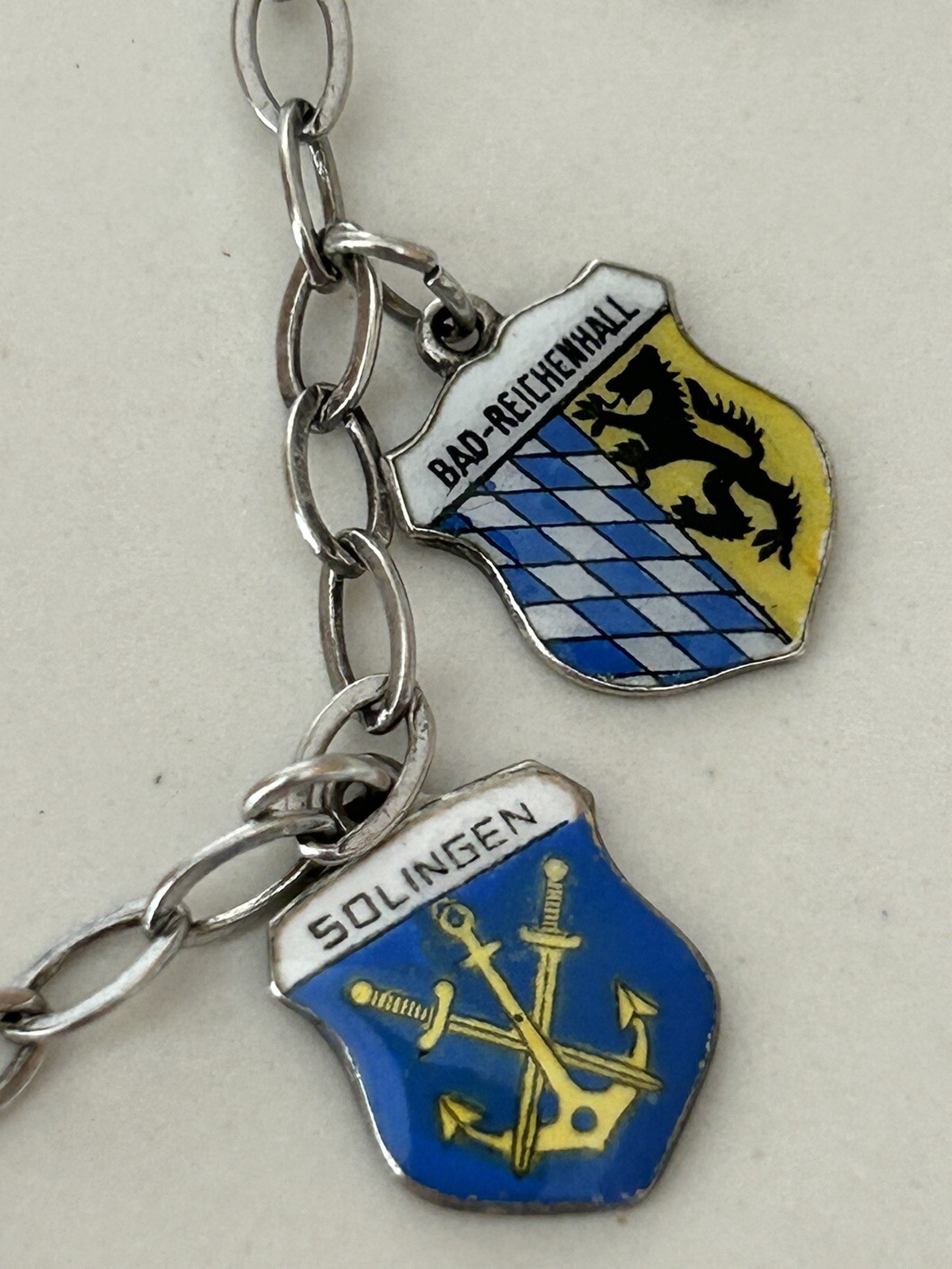 VINTAGE SOLID SILVER AND ENAMEL TRAVEL CHARM BRACELET6 COAT OF ARMS (8 TOTAL)
