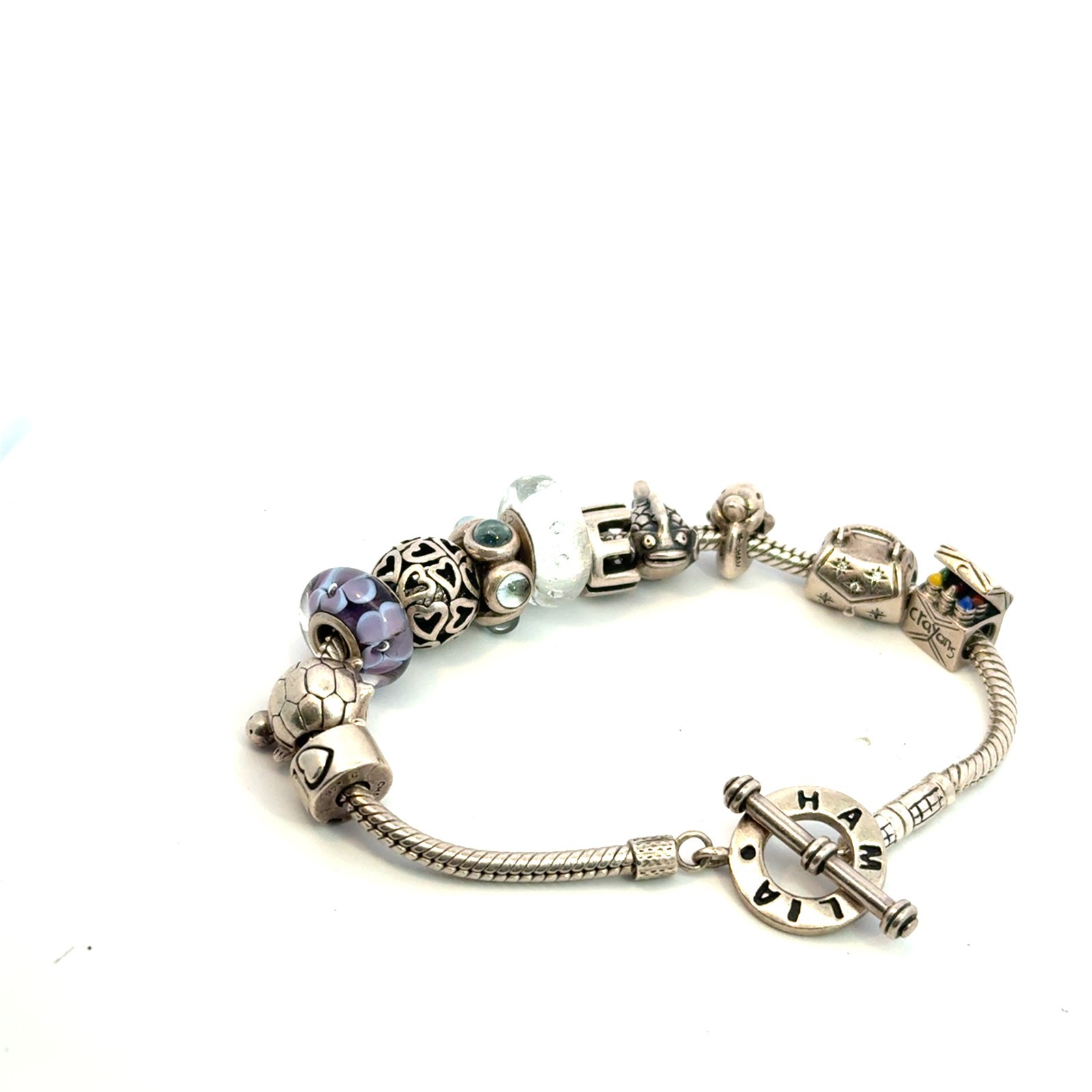 Authentic sterling silver chamilia 7.5in bracelet with 11 charms