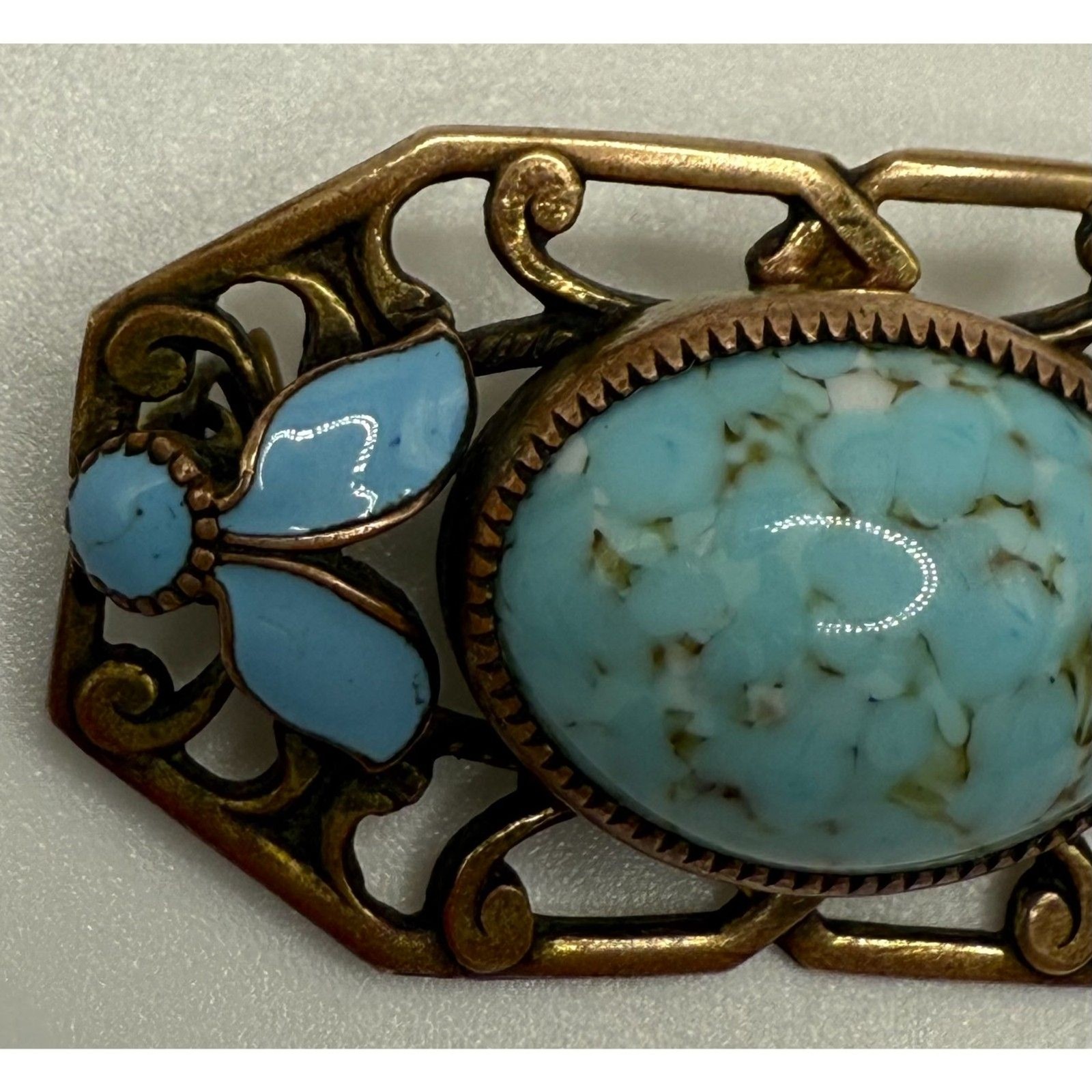 Turquoise brass brooch vintage source unknown
