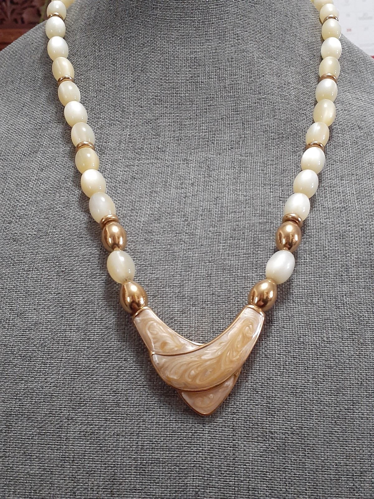 Napier champagne moonglow lucite bead necklace w/Chevron enamel pendant 24″