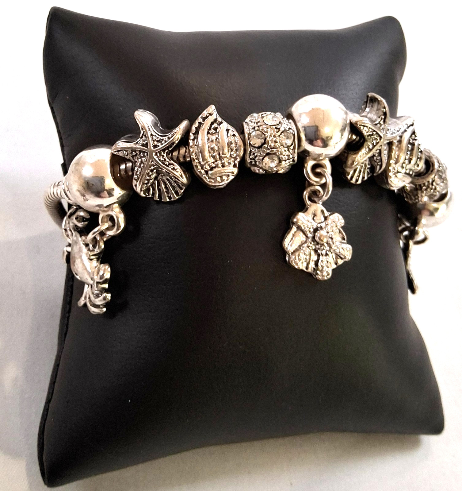 silver tone sea creatures shell 9 charm slide bracelet design