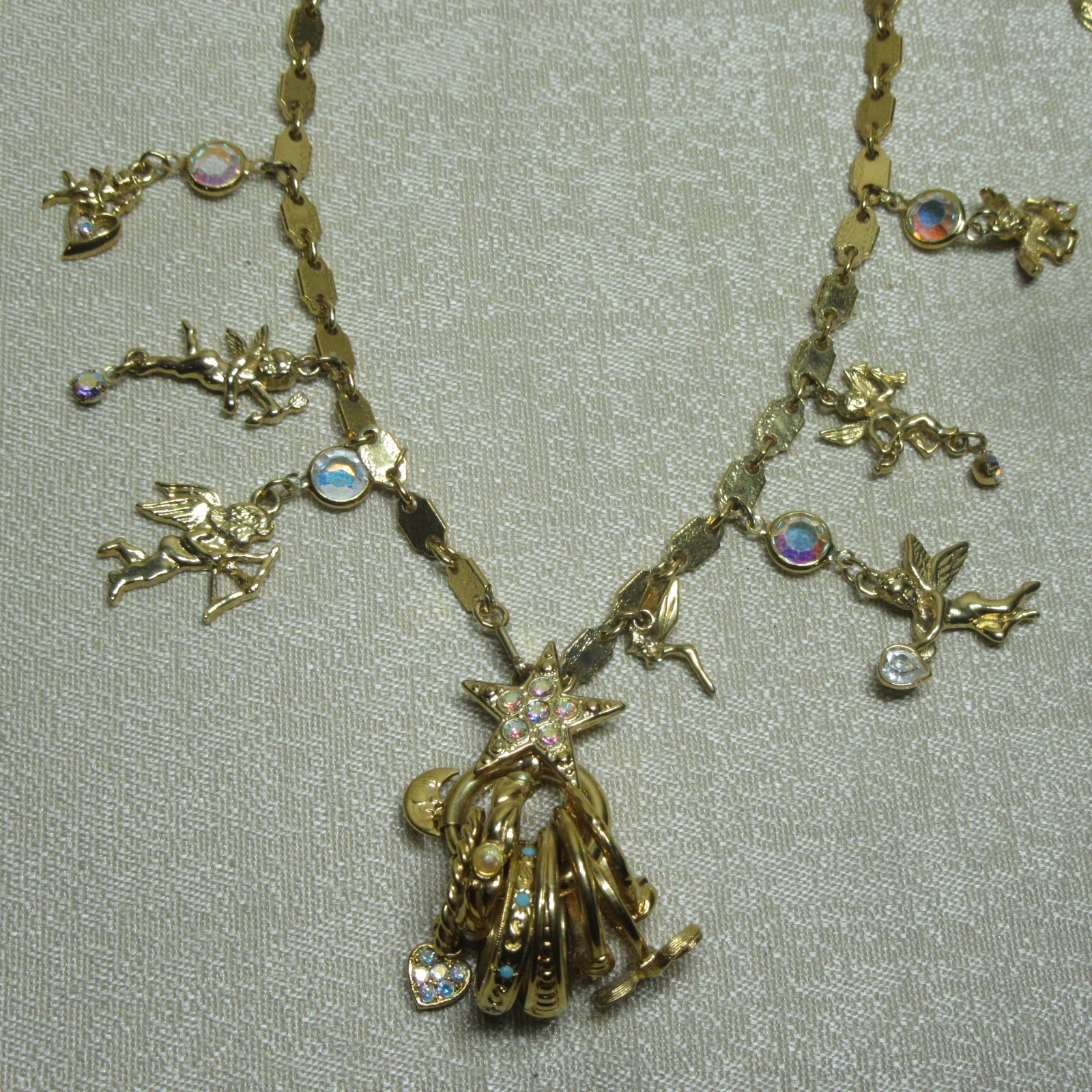 Vintage Goldtone Kirks Folly Seven Angels Charms and Ring Set